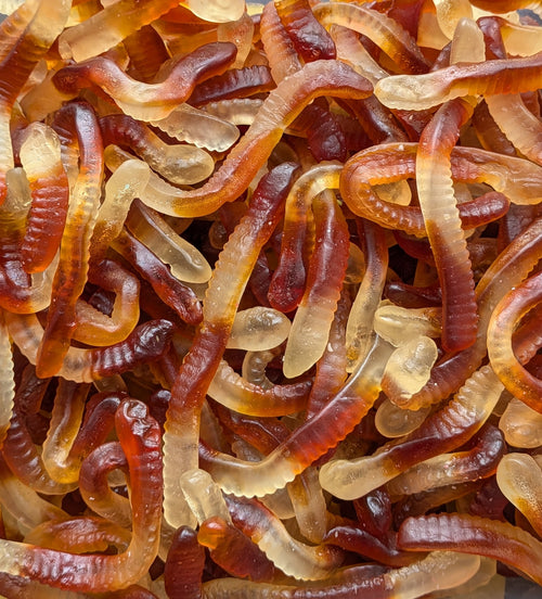 Close-up of a pile of gummy worms in various colors.