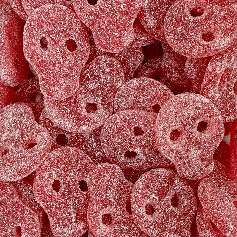 Close-up of red gummy skulls with a textured surface - Fresh Sweets | Mayflower Munchies Plymouth